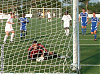 Warren watches the ball slam into the corner after Real score the first goal on a P.K.